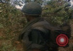 Image of soldiers in jungle Vietnam War Vietnam, 1968, second 38 stock footage video 65675080524