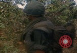 Image of soldiers in jungle Vietnam War Vietnam, 1968, second 40 stock footage video 65675080524