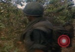 Image of soldiers in jungle Vietnam War Vietnam, 1968, second 41 stock footage video 65675080524