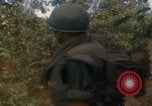 Image of soldiers in jungle Vietnam War Vietnam, 1968, second 42 stock footage video 65675080524