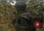 Image of soldiers in jungle Vietnam War Vietnam, 1968, second 45 stock footage video 65675080524