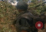 Image of soldiers in jungle Vietnam War Vietnam, 1968, second 46 stock footage video 65675080524