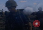 Image of US soldiers running Vietnam, 1968, second 9 stock footage video 65675080525