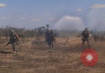 Image of US soldiers running Vietnam, 1968, second 11 stock footage video 65675080525