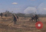 Image of US soldiers running Vietnam, 1968, second 12 stock footage video 65675080525