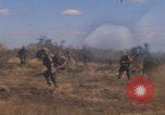 Image of US soldiers running Vietnam, 1968, second 13 stock footage video 65675080525