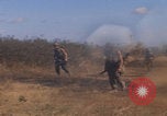 Image of US soldiers running Vietnam, 1968, second 16 stock footage video 65675080525