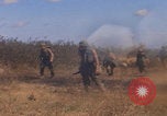 Image of US soldiers running Vietnam, 1968, second 17 stock footage video 65675080525