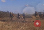 Image of US soldiers running Vietnam, 1968, second 19 stock footage video 65675080525