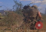 Image of US soldiers running Vietnam, 1968, second 23 stock footage video 65675080525