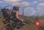 Image of US soldiers running Vietnam, 1968, second 26 stock footage video 65675080525