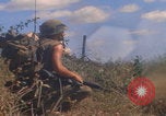 Image of US soldiers running Vietnam, 1968, second 27 stock footage video 65675080525