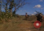 Image of US soldiers running Vietnam, 1968, second 31 stock footage video 65675080525