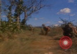 Image of US soldiers running Vietnam, 1968, second 32 stock footage video 65675080525