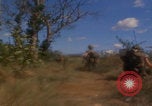 Image of US soldiers running Vietnam, 1968, second 34 stock footage video 65675080525