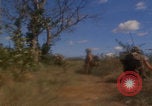 Image of US soldiers running Vietnam, 1968, second 39 stock footage video 65675080525