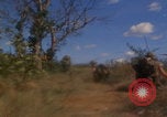 Image of US soldiers running Vietnam, 1968, second 40 stock footage video 65675080525