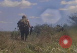 Image of US soldiers running Vietnam, 1968, second 45 stock footage video 65675080525