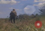 Image of US soldiers running Vietnam, 1968, second 46 stock footage video 65675080525