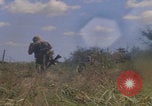 Image of US soldiers running Vietnam, 1968, second 47 stock footage video 65675080525