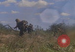 Image of US soldiers running Vietnam, 1968, second 48 stock footage video 65675080525