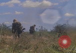 Image of US soldiers running Vietnam, 1968, second 49 stock footage video 65675080525