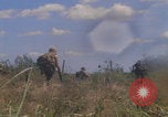 Image of US soldiers running Vietnam, 1968, second 52 stock footage video 65675080525