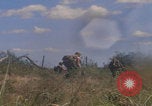 Image of US soldiers running Vietnam, 1968, second 54 stock footage video 65675080525