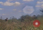 Image of US soldiers running Vietnam, 1968, second 60 stock footage video 65675080525