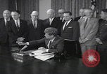 Image of President Kennedy signing Washington DC USA, 1963, second 1 stock footage video 65675080556