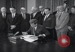 Image of President Kennedy signing Washington DC USA, 1963, second 4 stock footage video 65675080556
