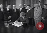 Image of President Kennedy signing Washington DC USA, 1963, second 7 stock footage video 65675080556