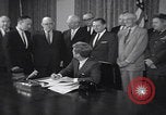 Image of President Kennedy signing Washington DC USA, 1963, second 8 stock footage video 65675080556