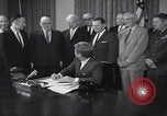 Image of President Kennedy signing Washington DC USA, 1963, second 9 stock footage video 65675080556