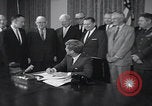Image of President Kennedy signing Washington DC USA, 1963, second 10 stock footage video 65675080556