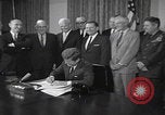 Image of President Kennedy signing Washington DC USA, 1963, second 12 stock footage video 65675080556