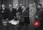 Image of President Kennedy signing Washington DC USA, 1963, second 15 stock footage video 65675080556