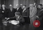 Image of President Kennedy signing Washington DC USA, 1963, second 17 stock footage video 65675080556