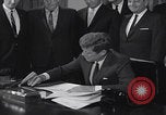 Image of President Kennedy signing Washington DC USA, 1963, second 20 stock footage video 65675080556