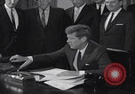 Image of President Kennedy signing Washington DC USA, 1963, second 21 stock footage video 65675080556