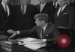 Image of President Kennedy signing Washington DC USA, 1963, second 22 stock footage video 65675080556