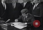 Image of President Kennedy signing Washington DC USA, 1963, second 23 stock footage video 65675080556