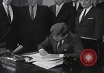 Image of President Kennedy signing Washington DC USA, 1963, second 24 stock footage video 65675080556
