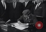 Image of President Kennedy signing Washington DC USA, 1963, second 26 stock footage video 65675080556