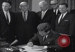 Image of President Kennedy signing Washington DC USA, 1963, second 28 stock footage video 65675080556