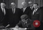 Image of President Kennedy signing Washington DC USA, 1963, second 29 stock footage video 65675080556