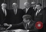 Image of President Kennedy signing Washington DC USA, 1963, second 31 stock footage video 65675080556