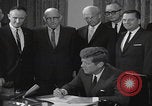 Image of President Kennedy signing Washington DC USA, 1963, second 33 stock footage video 65675080556