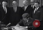 Image of President Kennedy signing Washington DC USA, 1963, second 35 stock footage video 65675080556