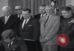 Image of President Kennedy signing Washington DC USA, 1963, second 44 stock footage video 65675080556